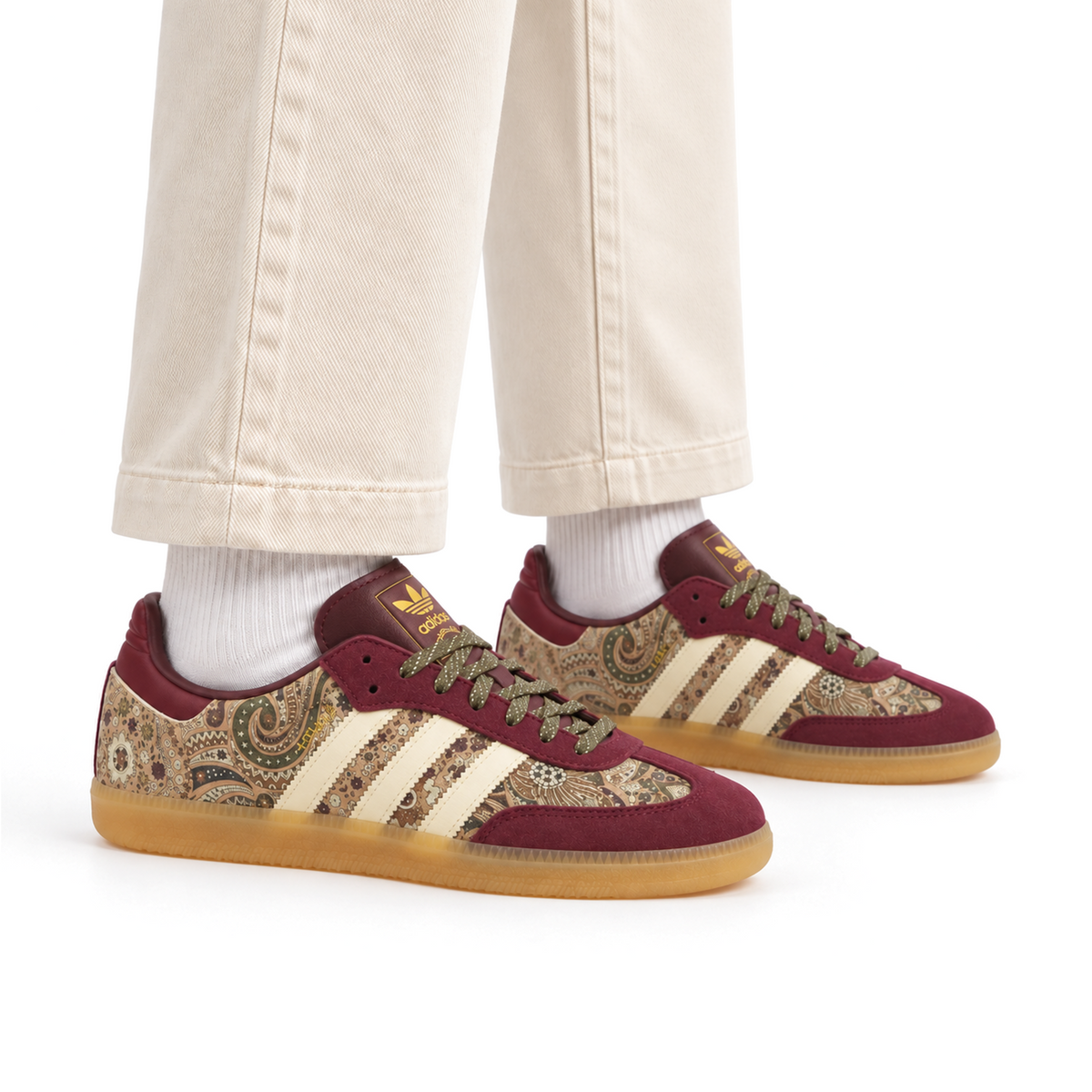 Maroon paisley adidas x Liberty London Samba OG worn with cream trousers and white socks, both shoes facing right
