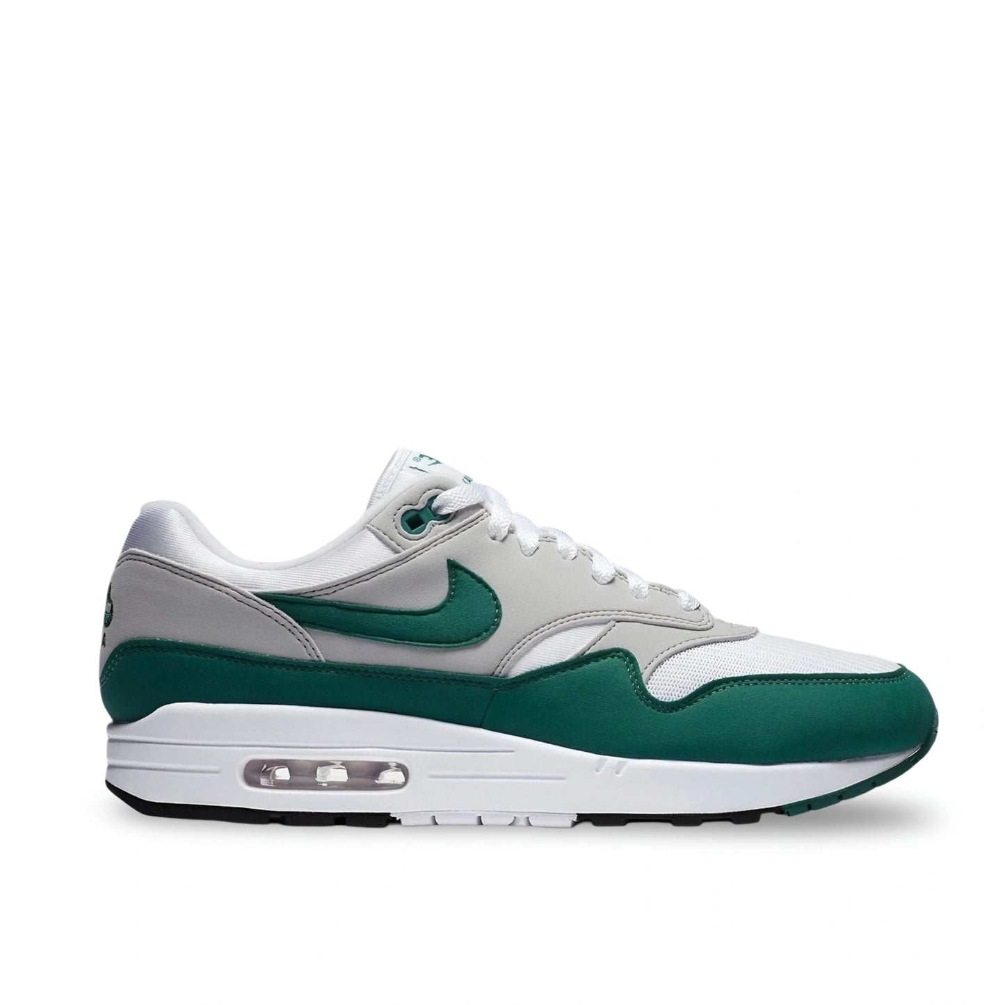 Side view of the Nike Air Max 1 Anniversary in Hunter Green with white mesh, grey leather overlays, and green mudguard
