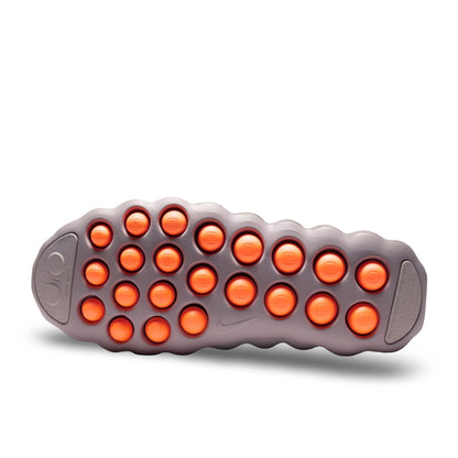 Nike Mind 002 outsole with orange traction pods