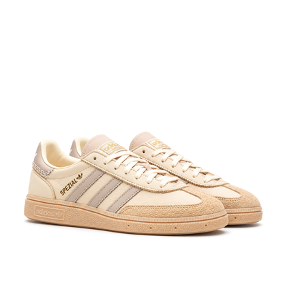 Right-facing front three-quarter pair of adidas Handball Spezial Cream White Beige showing tonal laces and textured toe overlays