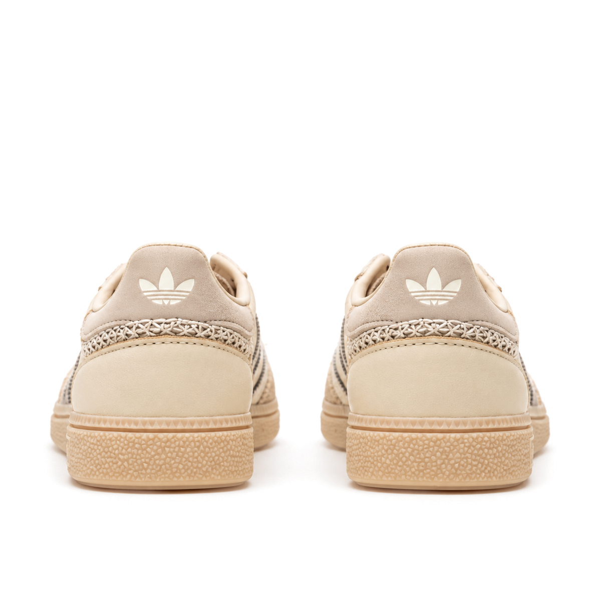 Straight rear pair of adidas Handball Spezial Cream White Beige showing the pale heel tabs and diagonal cross-stitch heel bands