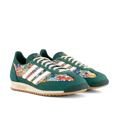Front three-quarter view of the green floral adidas x Liberty London SL 72 OG pair, showing cream laces and green toe overlays.