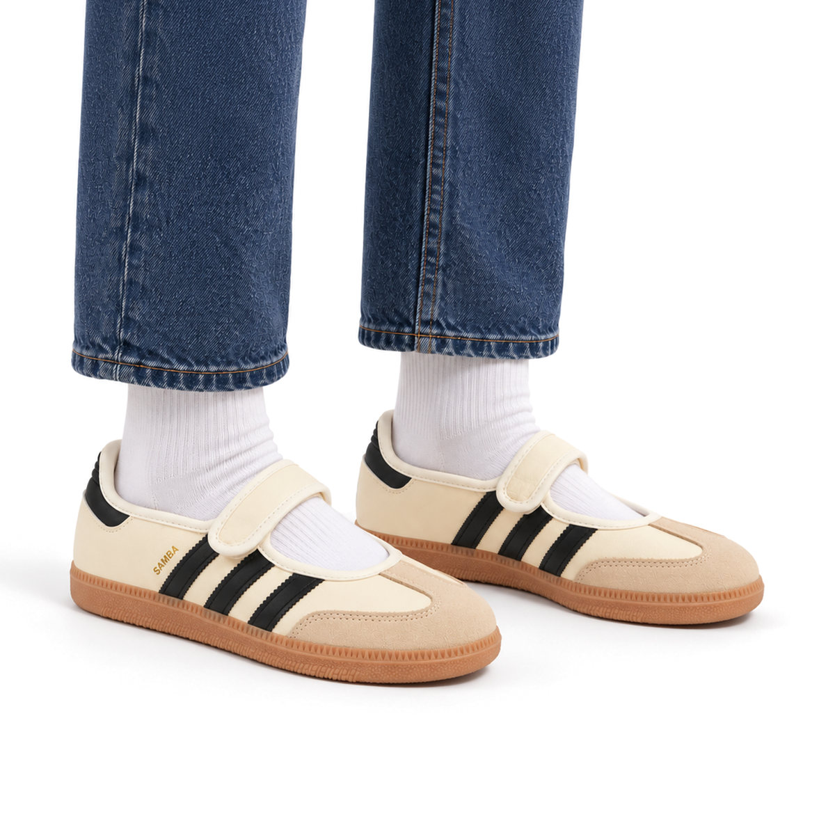 Adult wearing right-facing adidas Samba Jane Cream White shoes with indigo jeans and white socks
