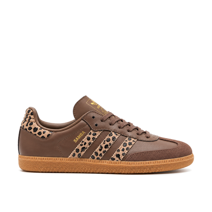 Right-facing side view of the brown adidas Samba OG, with tan-and-black leopard-print Three Stripes, gold Samba lettering and a gum sole.