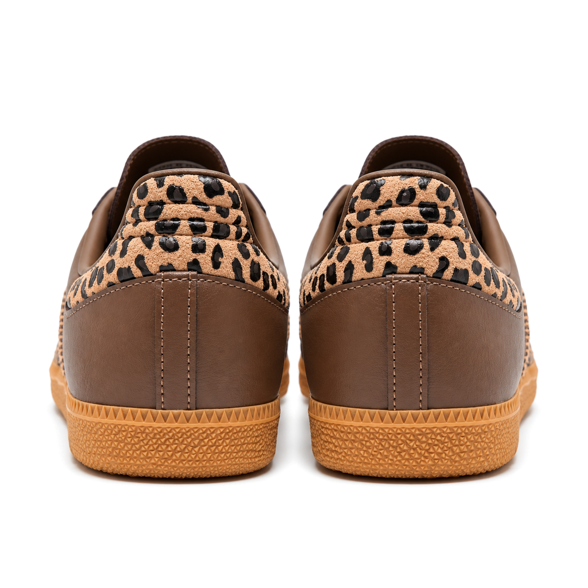 Rear view of the brown adidas Samba OG pair, showing ridged leopard-print heel panels, stitched brown heels and textured gum soles.