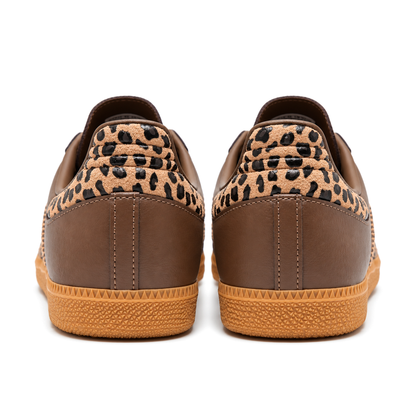 Rear view of the brown adidas Samba OG pair, showing ridged leopard-print heel panels, stitched brown heels and textured gum soles.