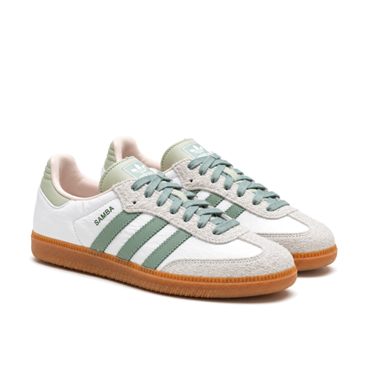 Right-facing front three-quarter pair of adidas Samba Silver Green shoes with light grey toe overlays and green laces