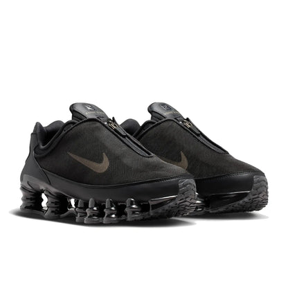 Pair of Nike Shox TL Winterized Black and Cave Stone unisex sneakers